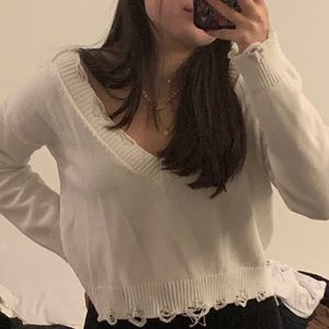white distressed v neck sweater